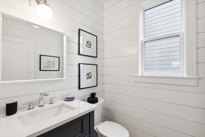 Model Home - Madison Plan Powder Room with custom vanity and shiplap on walls